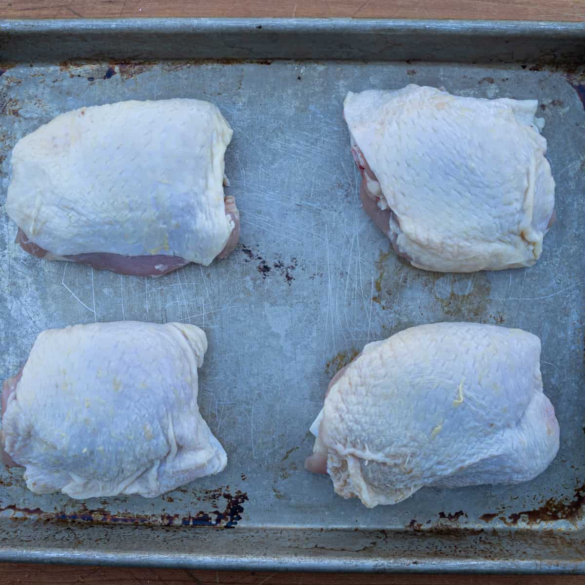 Raw chicken thighs waiting to be prepped