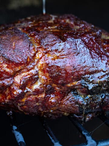 Pork Shoulder on the Smoker hit with smoke from my favorite wood for pulled pork: hickory wood