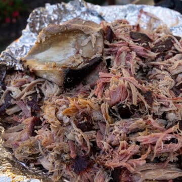 Shredded Smoked Pulled Pork hit with smoke from my favorite wood for pulled pork: hickory wood