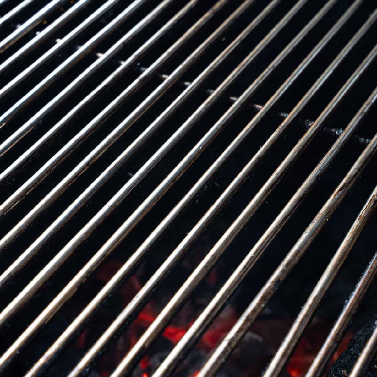 showing cleaned grill grates -- essential for preventing chicken from sticking to the grill