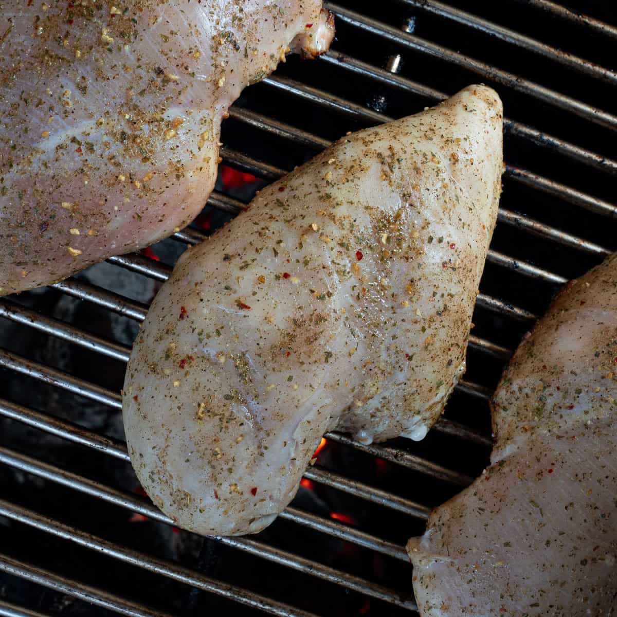 Raw & Seasoned Chicken Breast on the Grill -- showing how to cook without it sticking to the grates