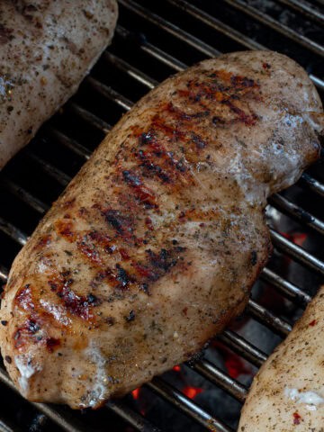 Showing how to cook chicken breast on the grill without it sticking