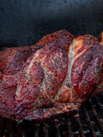 pork butt on smoker hit with my favorite wood for pulled pork: hickory wood