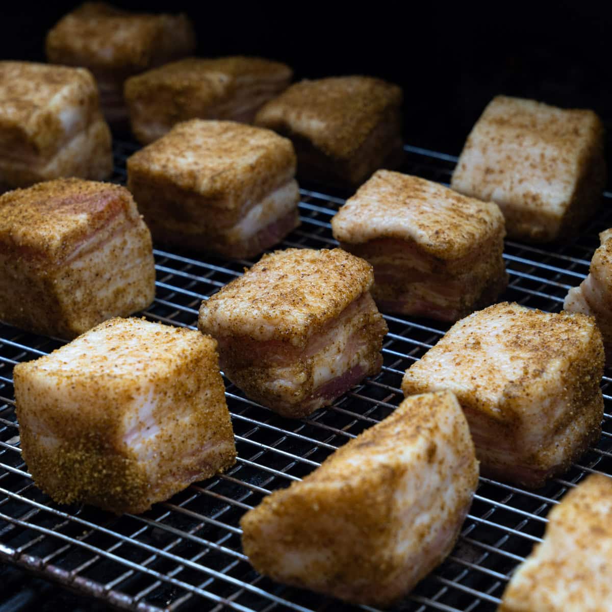 Seasoned Pork Belly Placed on the Smoker