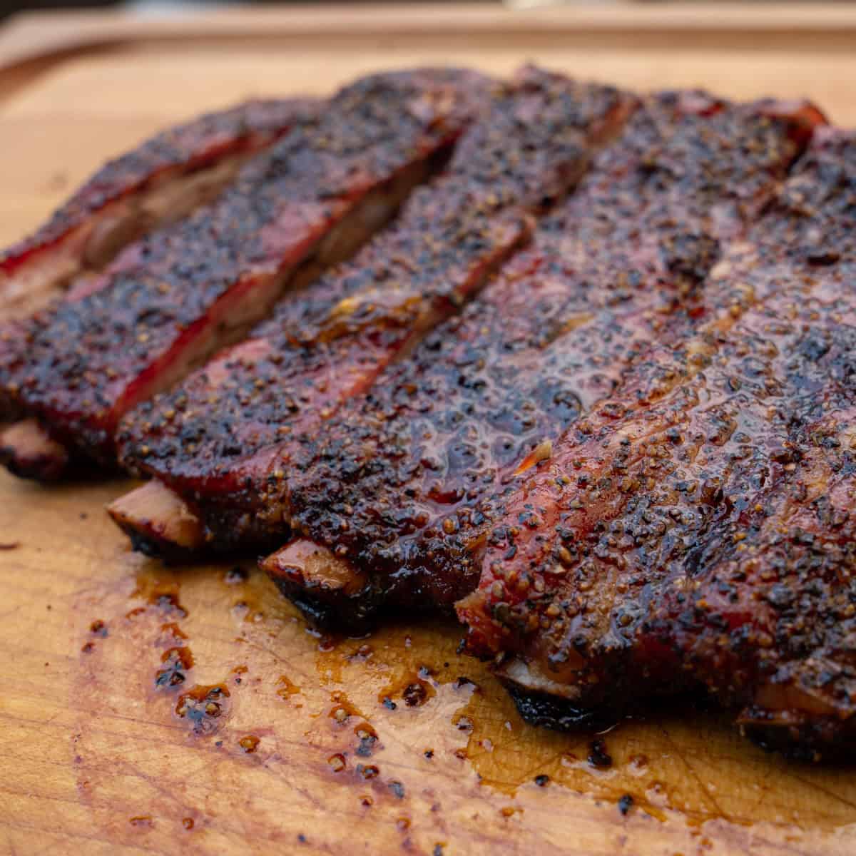 Smoked Pork Ribs with Apple Habanero Glaze that have been freshly sliced