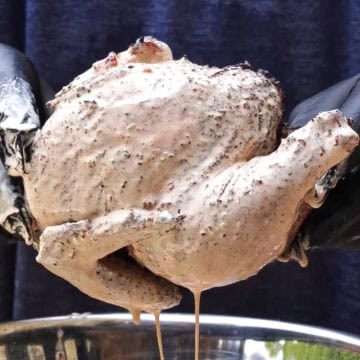 Chicken halves dipped in homemade georgia white sauce