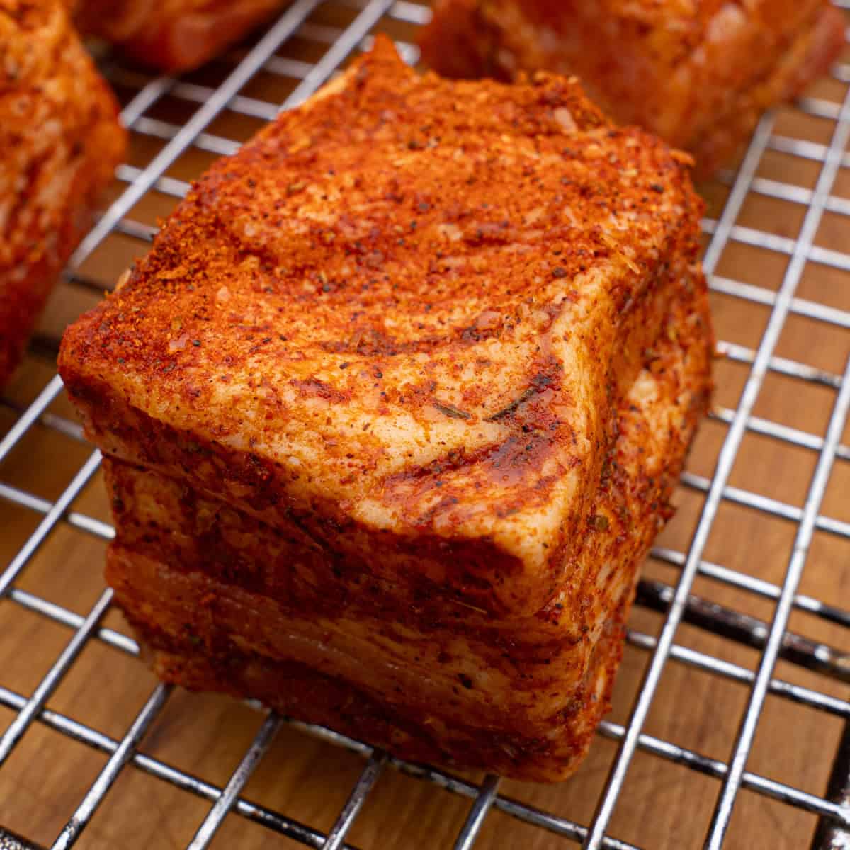 Seasoned pork belly ready for the smoker