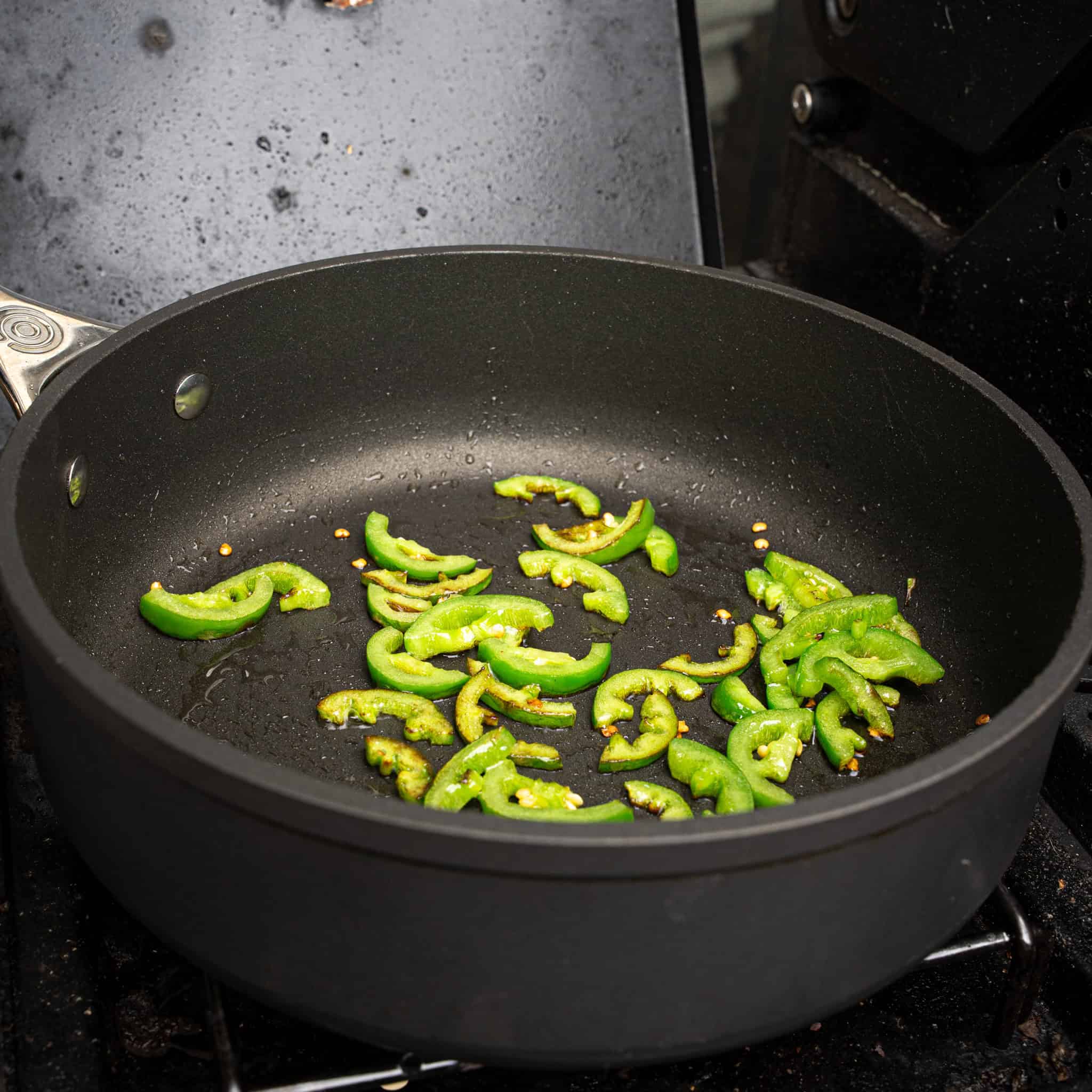 Sautéing jalapeños in a skillet