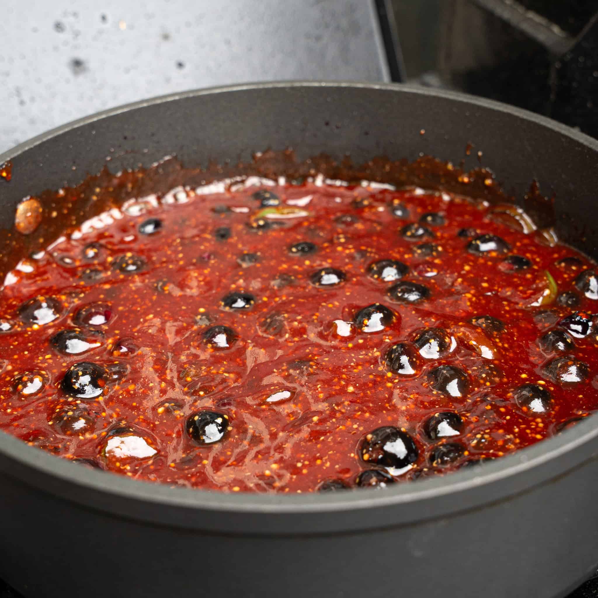 simmering ingredients for the blueberry bbq sauce
