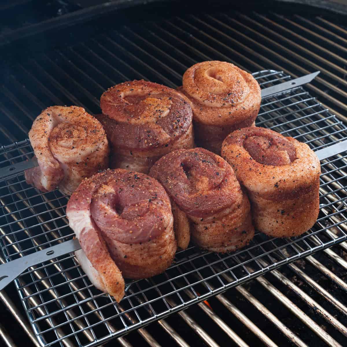 Seasoned & Skewered Pork Belly Lollipops being Put on The Smoker