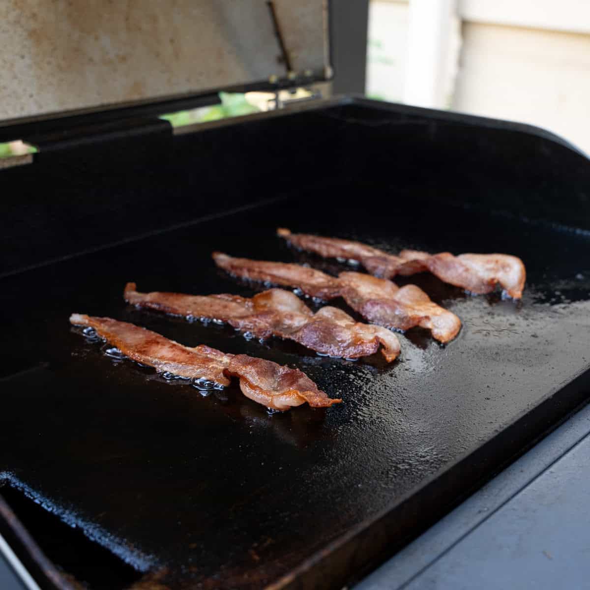 cooking bacon on the griddle