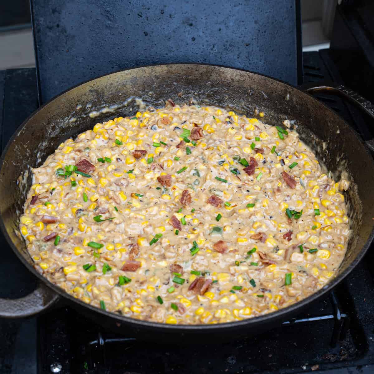 All ingredients have been mixed into the spicy creamed corn and it is now off-heat