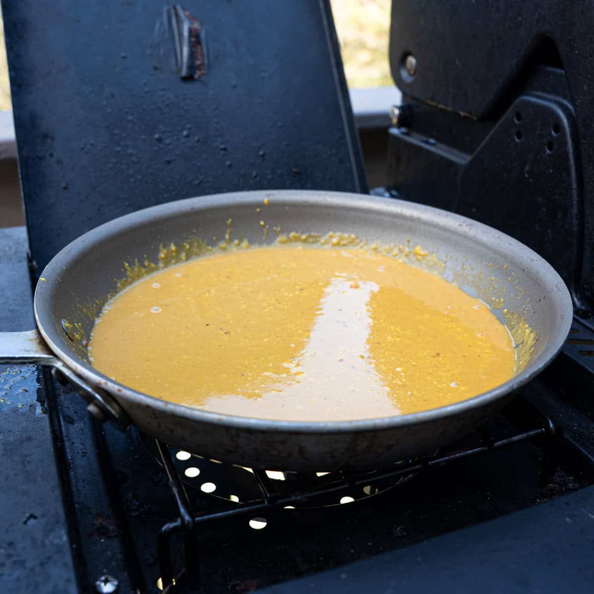 Adding all ingredients for my Georgia bbq sauce in a pan