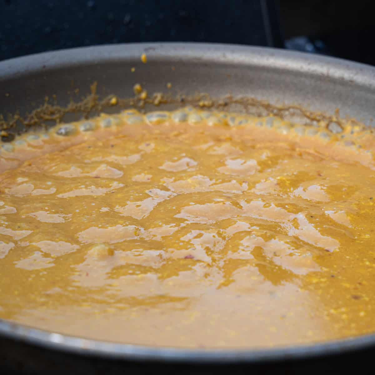 simmering bbq sauce in a pan