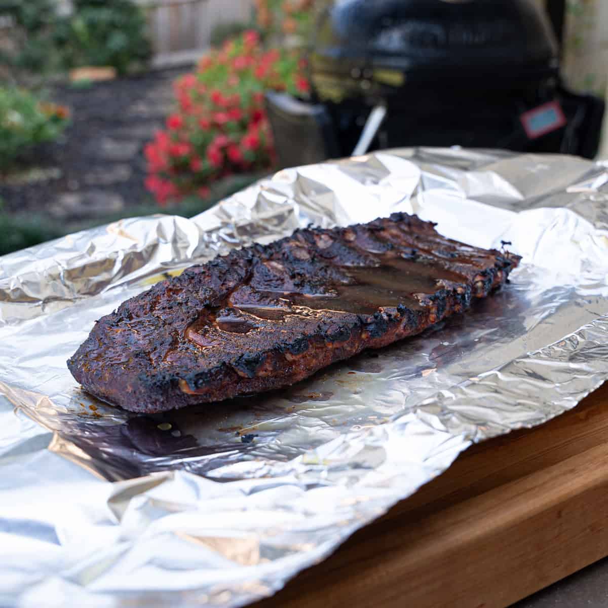 adding liquid to the wrap to help steam the meat once wrapped and placed back on the smoker