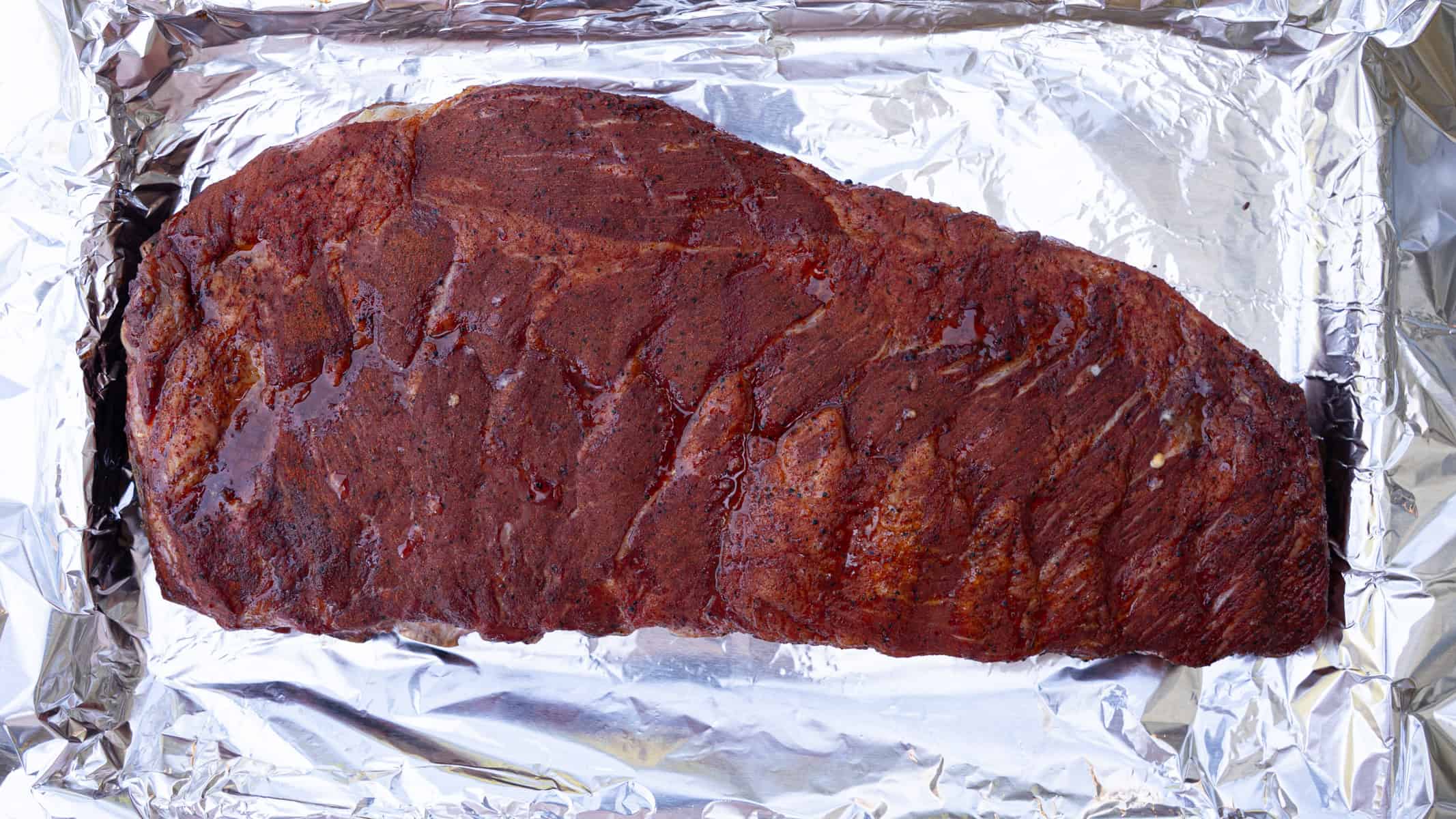 Smoked ribs that have just been pulled off of the smoker after 3 hours unwrapped