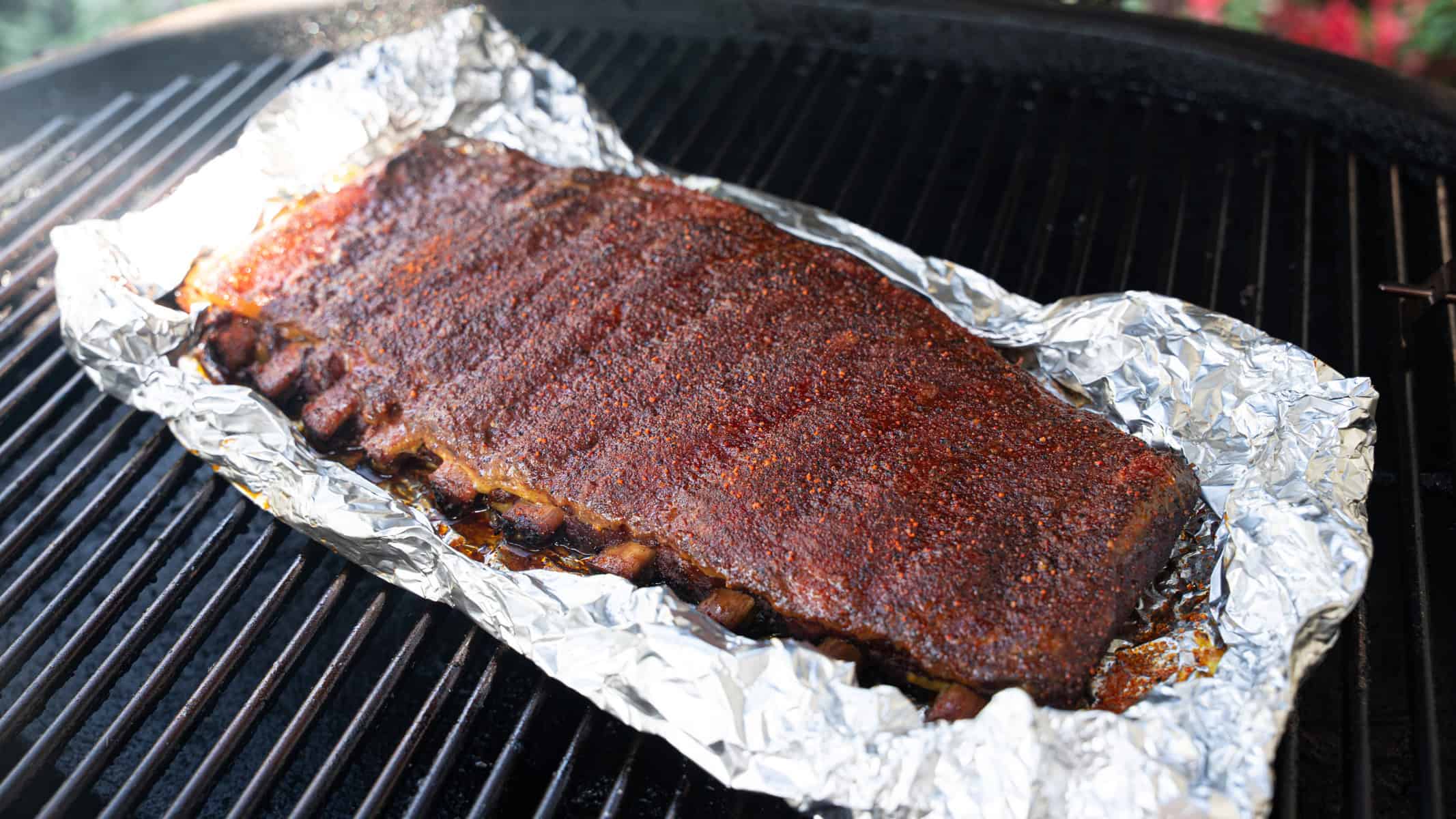 Ribs are on the smoker for the final hour, allowing the rub and BBQ sauce to set