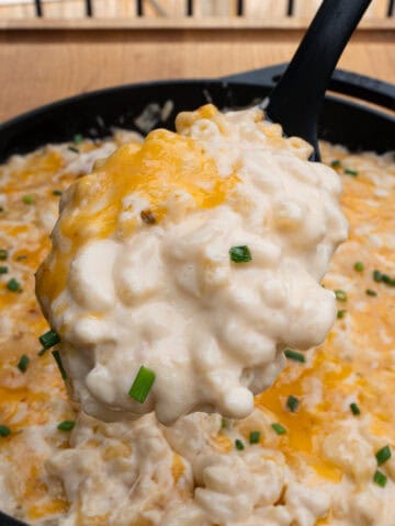 Serving a spoonful of the creamy southern Mac and cheese with gouda cheese