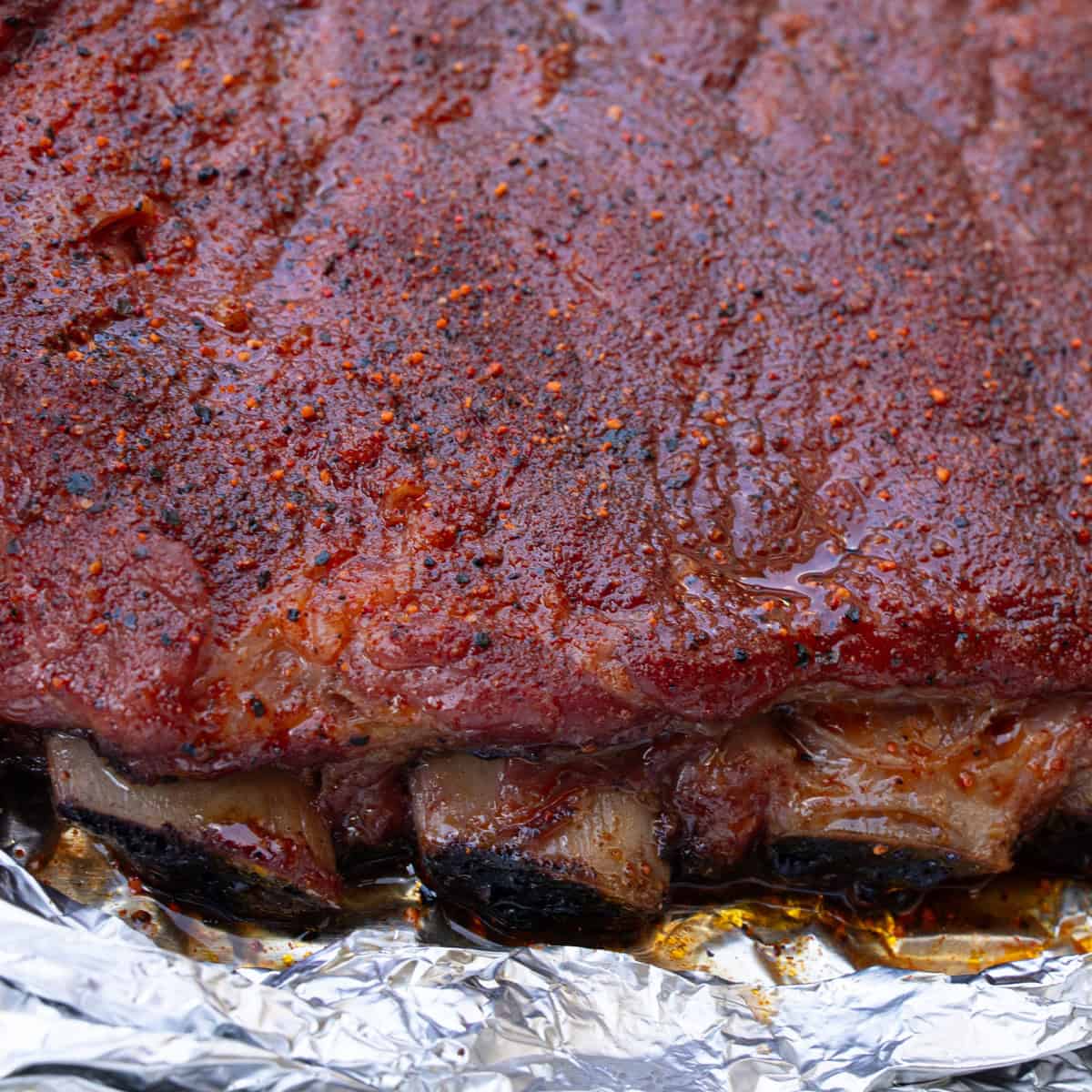 Showing the pull back that has occurred with the meat of the ribs as the bones are now showing