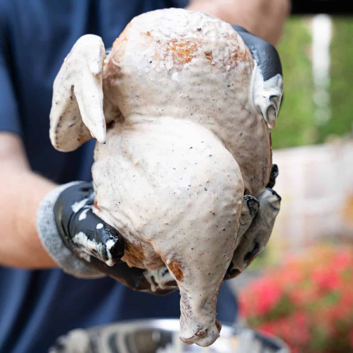 Smoked Chicken Halves dunked in Alabama white sauce