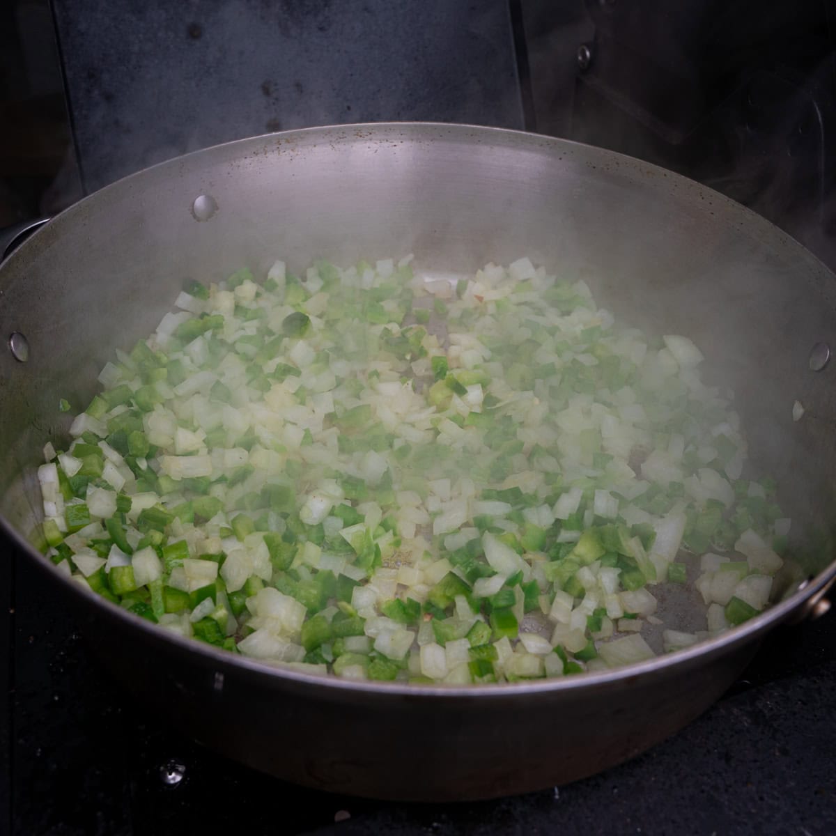 Sautéing vegetables in the pot for chili