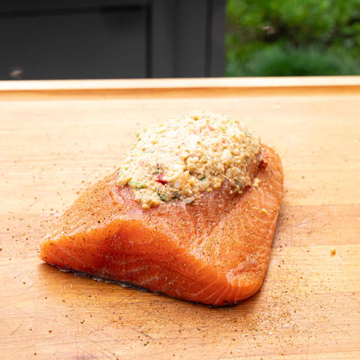 Prepared salmon that has just been stuffed with shrimp stuffing