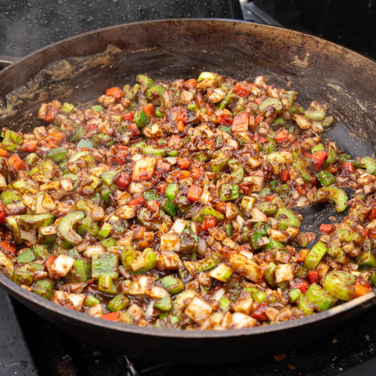 Sautéing holy trinity vegetables in the roux
