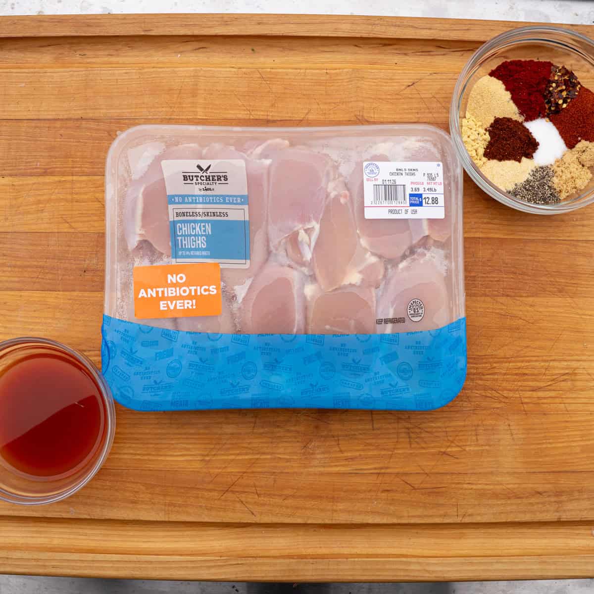 Gathering Ingredients to Season Boneless Chicken Thighs