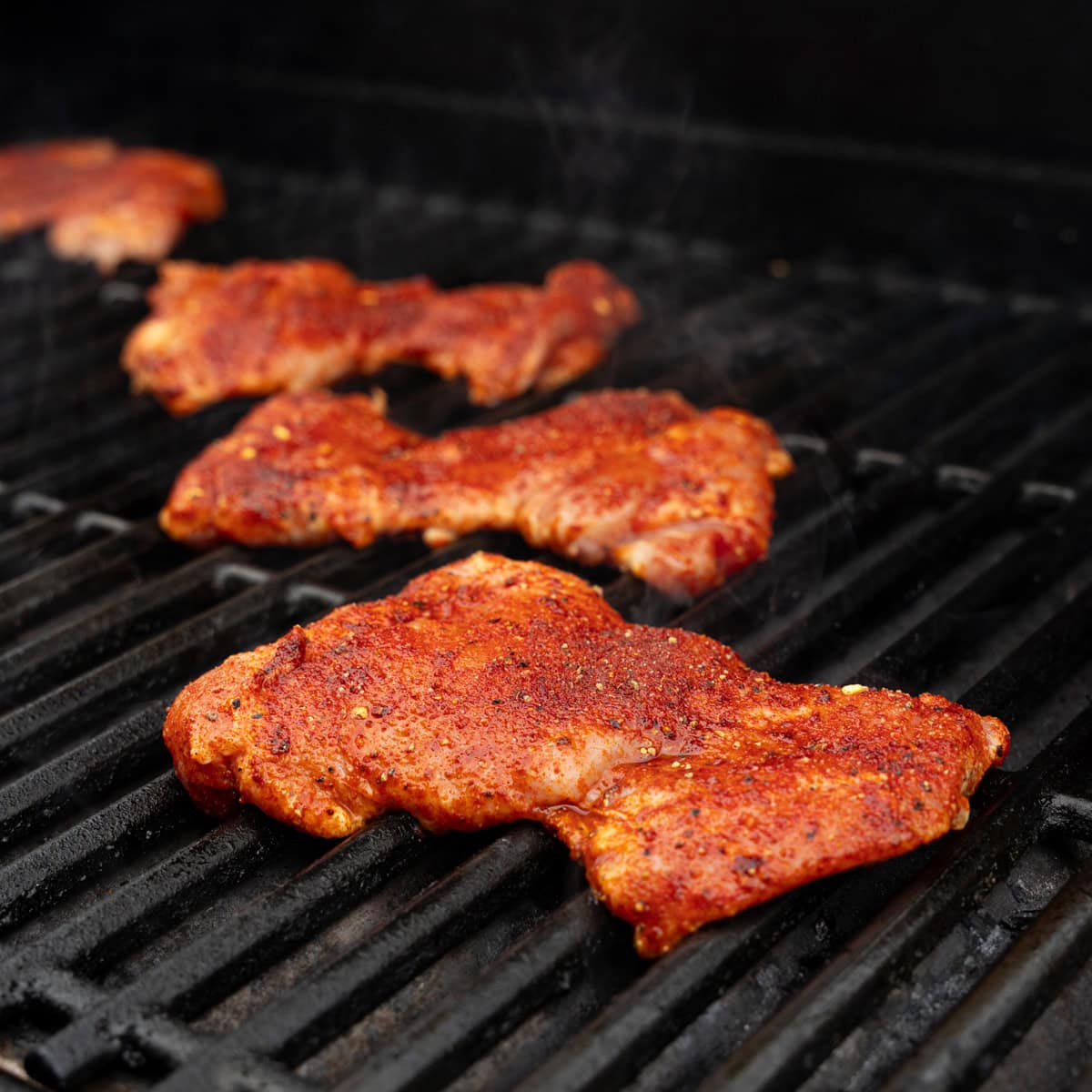 Seasoned Chicken Freshly Placed on The Grill