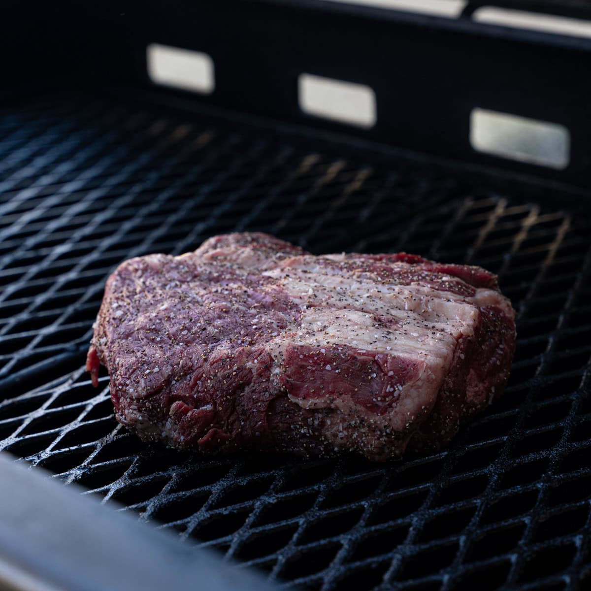 Seasoned Chuck Roast Recently Placed on The Smoker