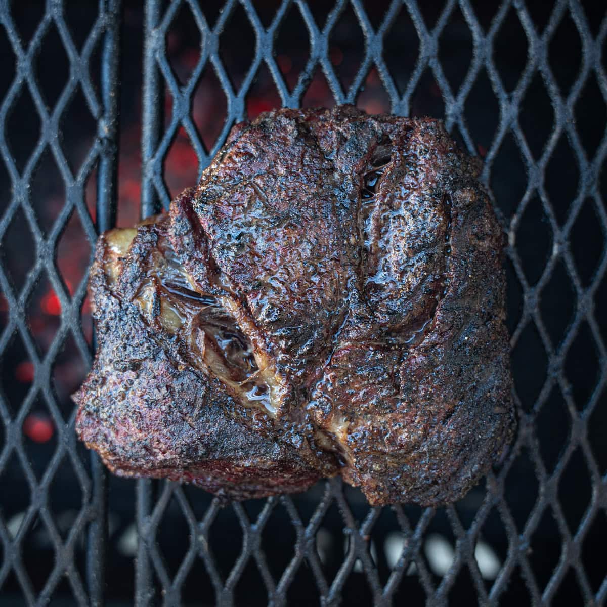 Chuck Roast on the smoker with the bark starting to form