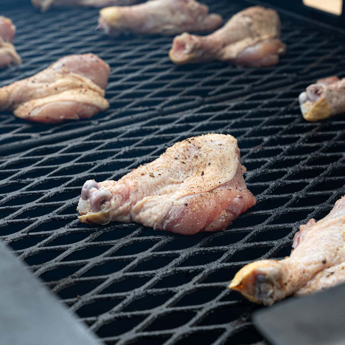 Seasoned Butterflied Drumsticks Recently Placed on The Grill