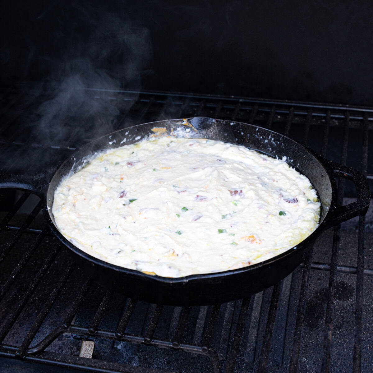 Jalapeño Popper Dip finishing up cooking on the smoker