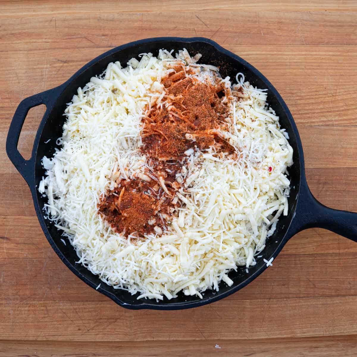 Adding all of the ingredients to the skillet