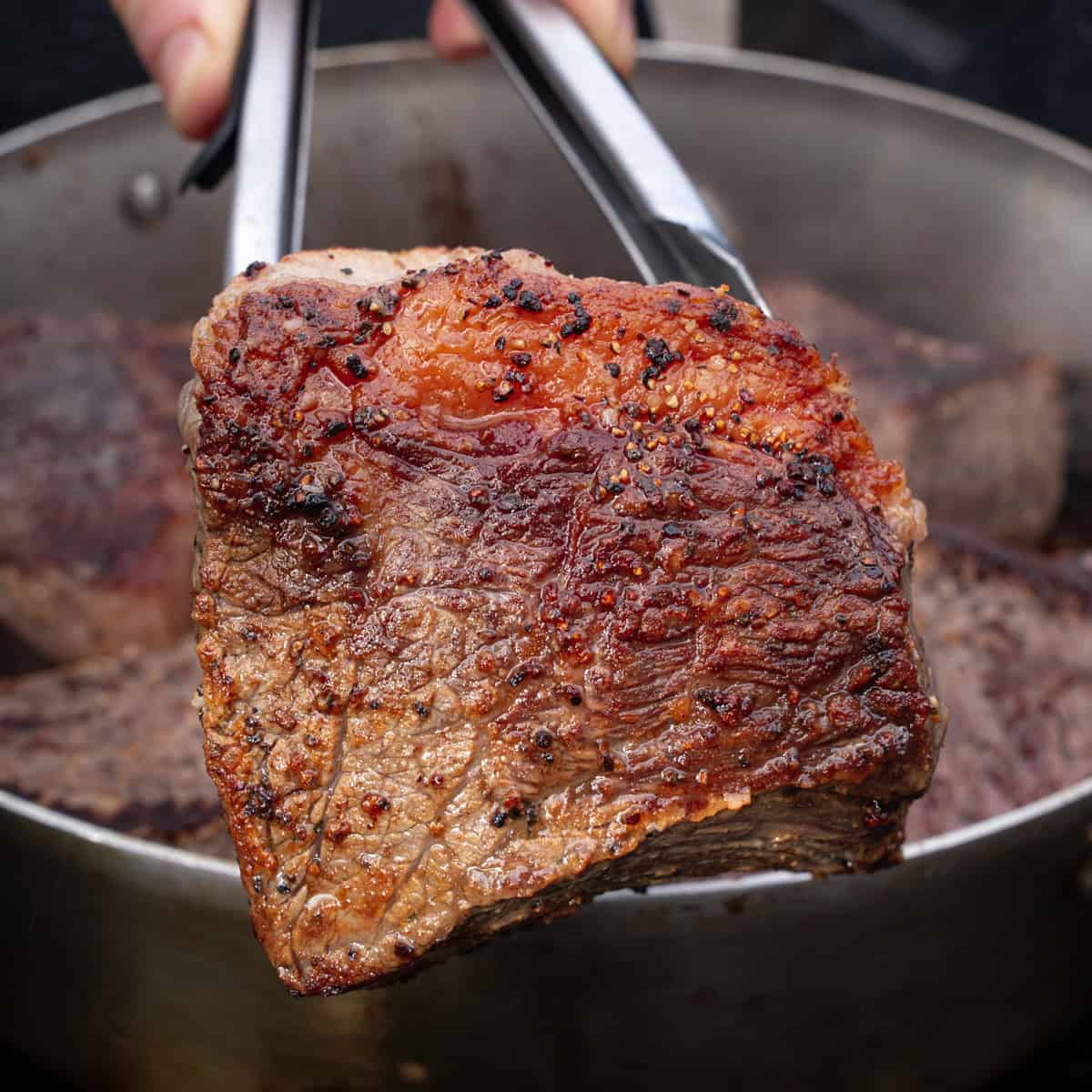 Quartered bottom round roast that has been browned