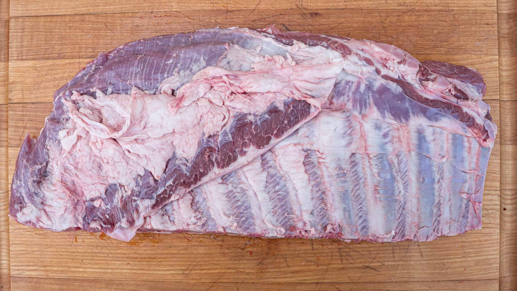 Fresh, raw rack of untrimmed spare ribs