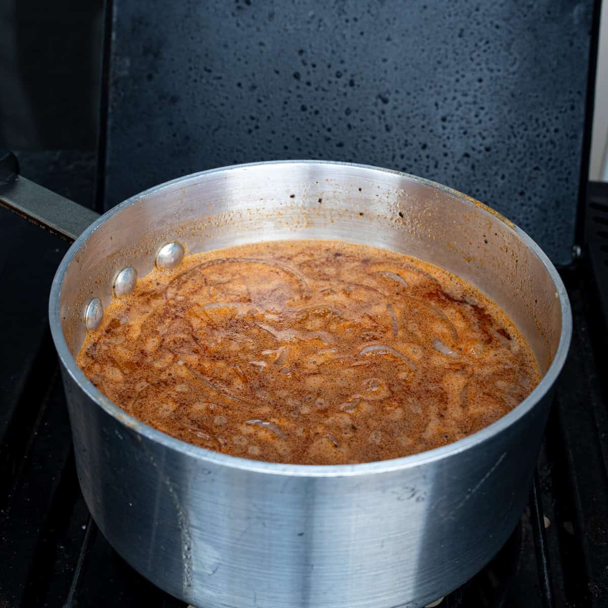 Mop sauce simmering in a saucepan