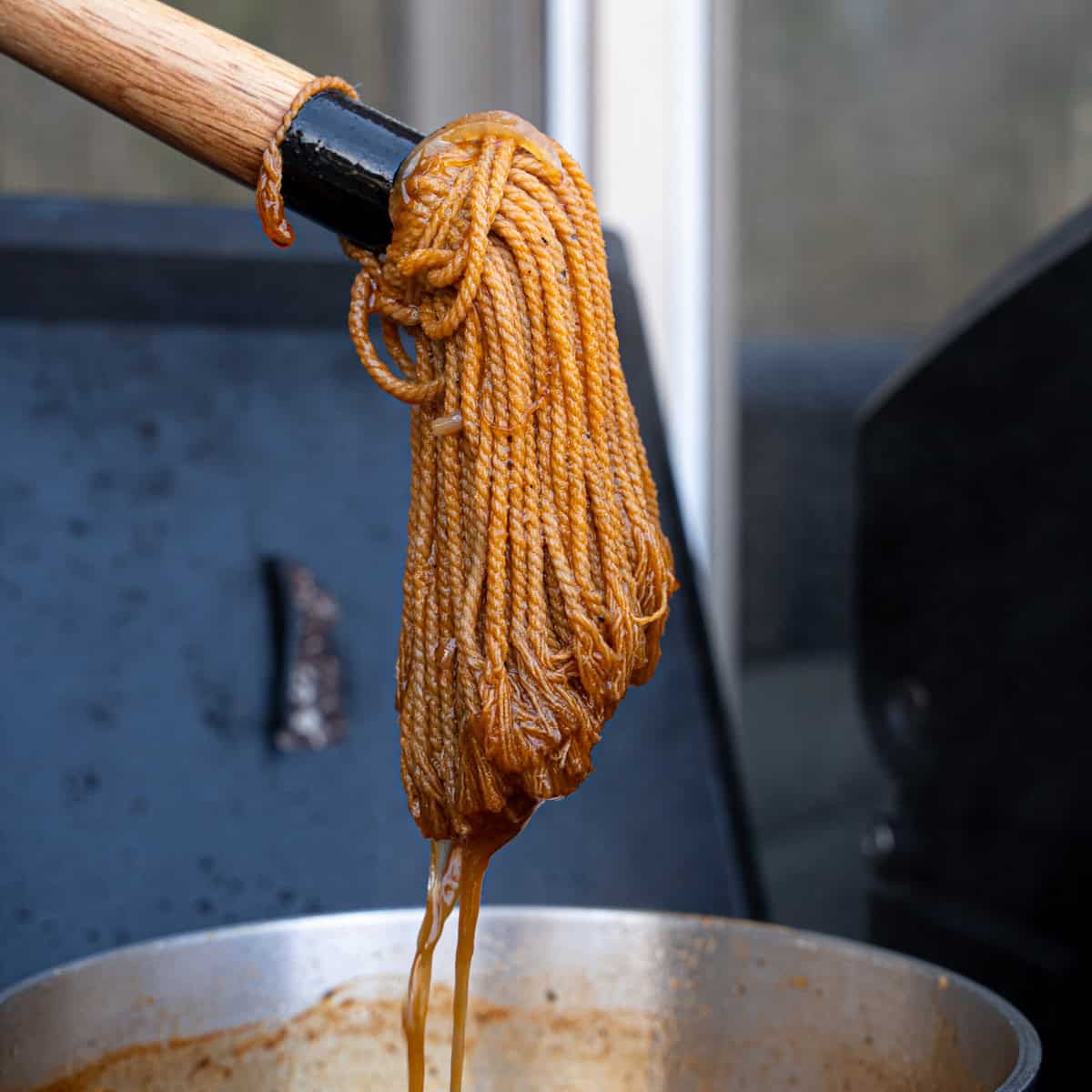 Mop Sauce dripping off of a BBQ mop