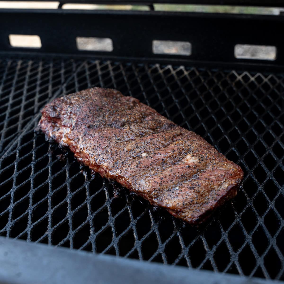 Ribs cooking over direct heat on the grill