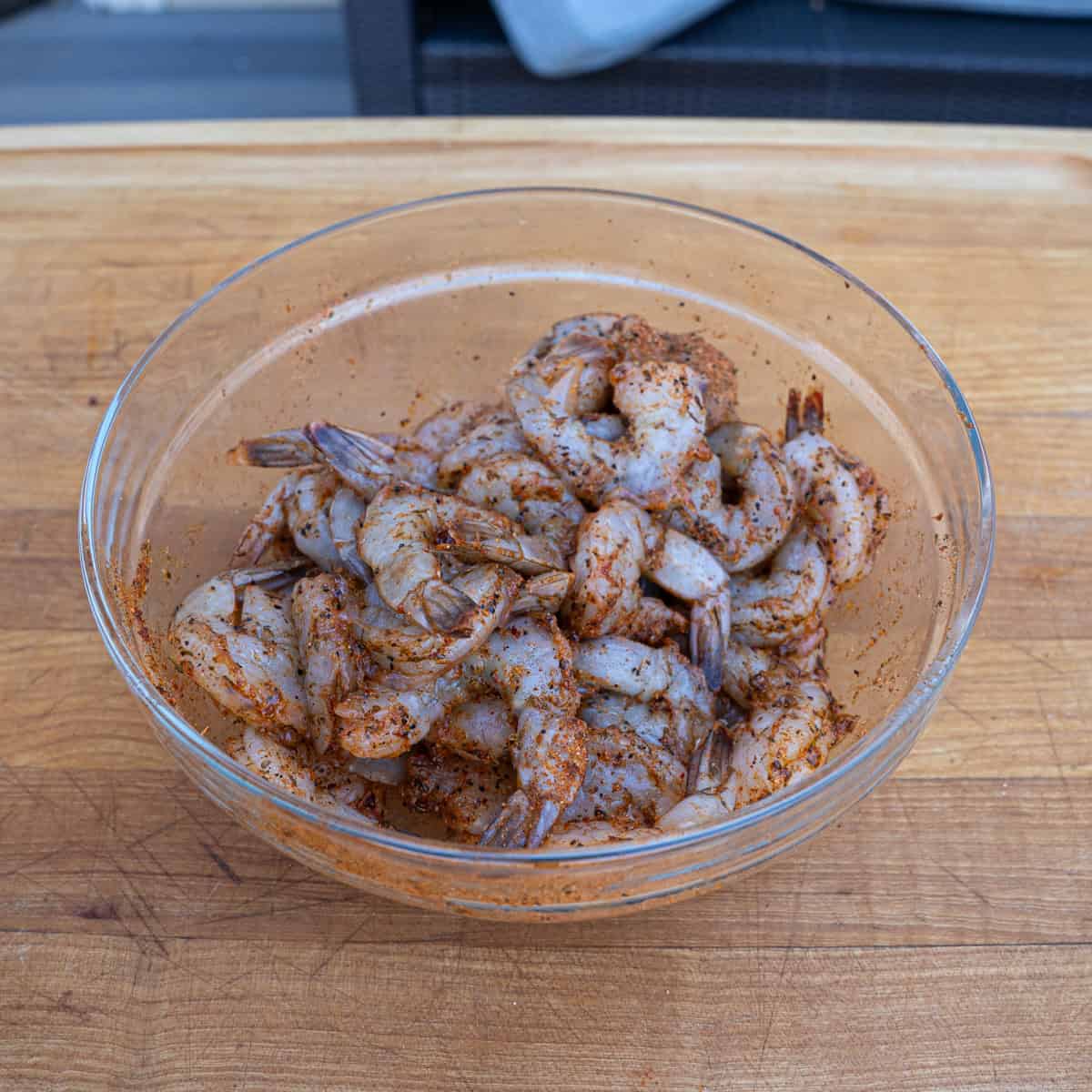 Shrimp seasoned with cajun seasoning before being butterflied and stuffed