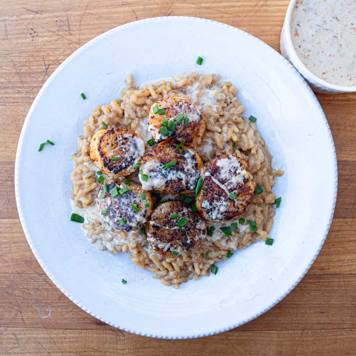 Blackened Scallops with Cajun Cream Sauce Served Over Risotto