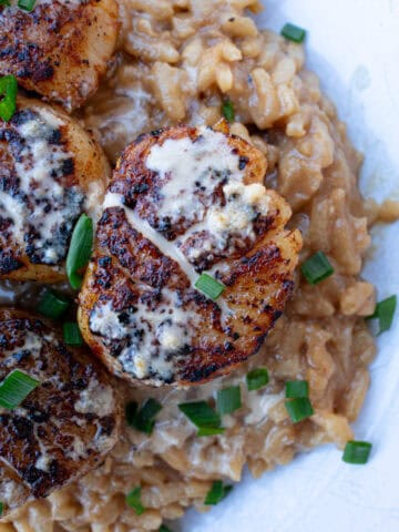 Blackened Scallops with Cajun Cream Sauce Served Over Risotto