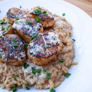 Blackened Scallops with Cajun Cream Sauce Served Over Risotto