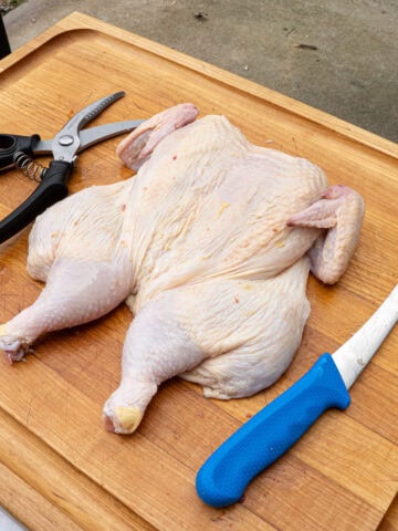 A whole chicken that has been spatchcocked