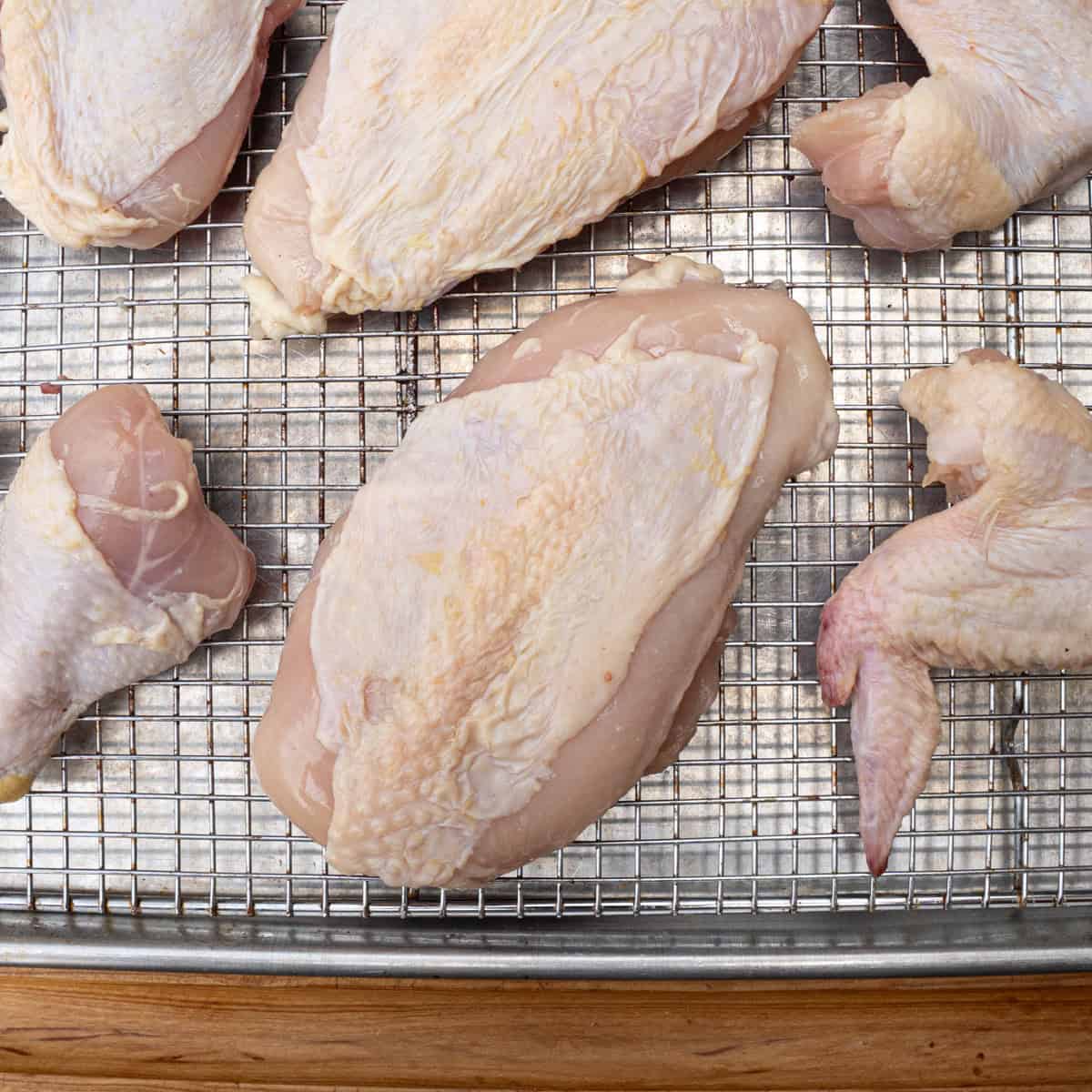 Raw chicken breast sliced from a whole chicken