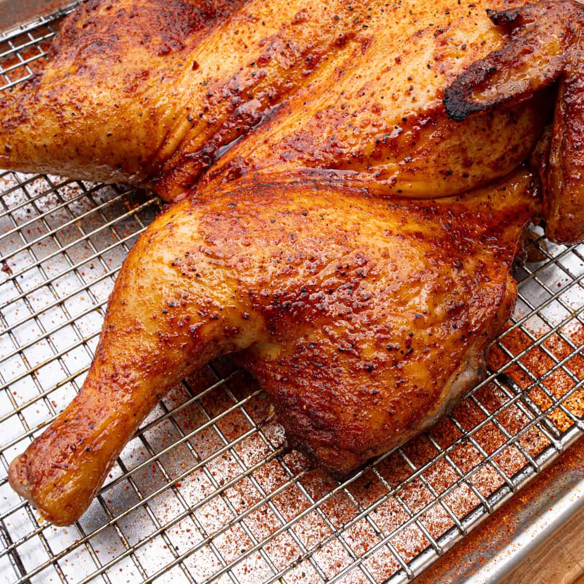 Smoked spatchcock chicken finished cooking and recently pulled off of a pellet grill
