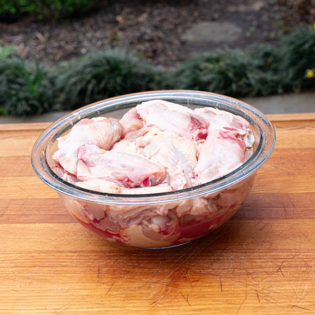 Chicken wings sitting in a pickle juice brine