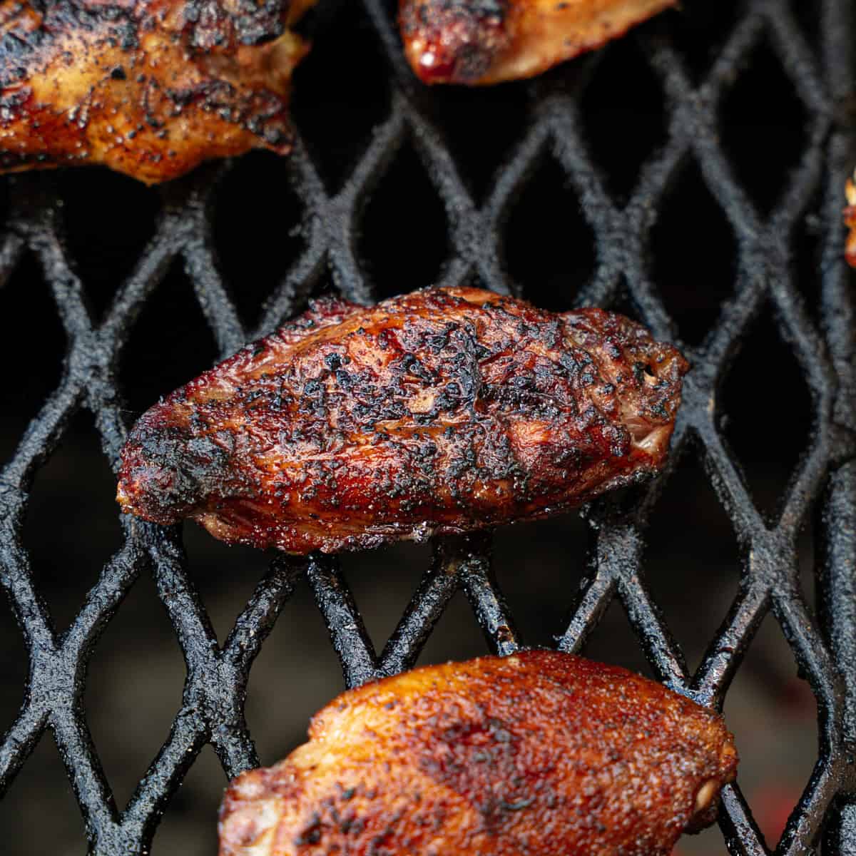 Chicken wing after being flipped once on the grill