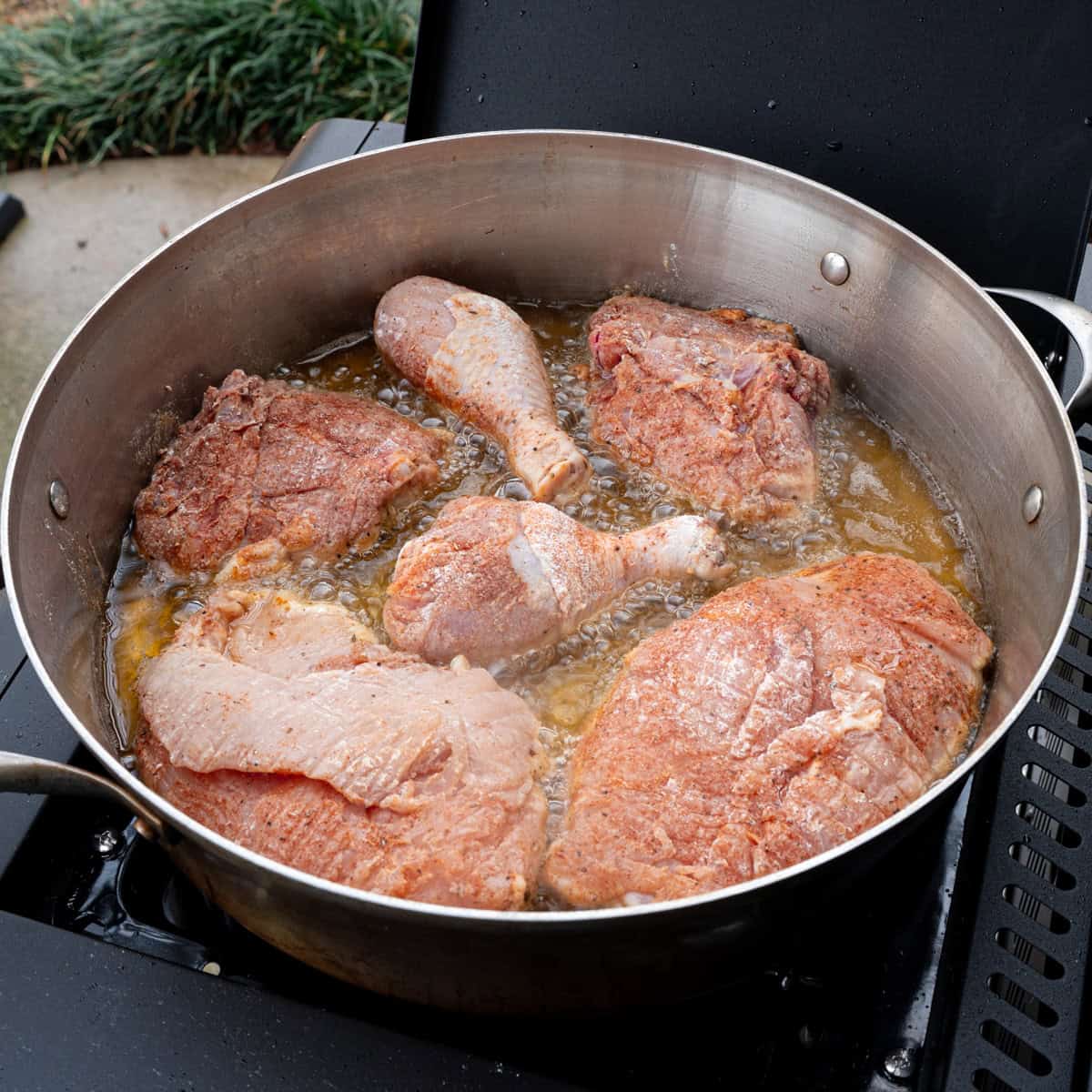 Flour-breaded chicken pan searing in oil