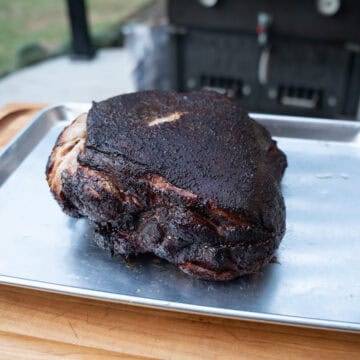 A smoked pork butt fresh off of the smokeand taken out of the wrap